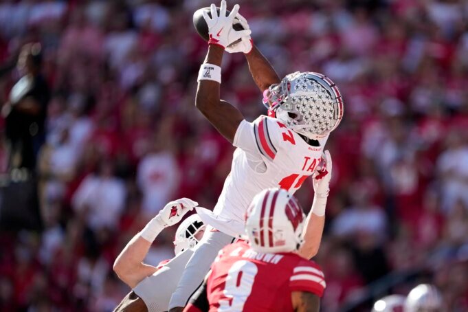 “多麼瘋狂的傳球和接 NCAA Football: Ohio State at Wisconsin - Source: Imagn