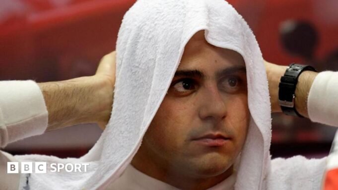 Felipe Massa puts a towel over his head during the Singapore Grand Prix in 2008 